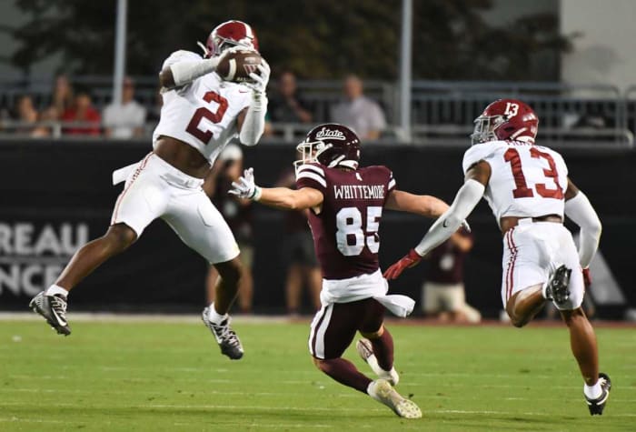 Sep 30, 2023; Starkville, Mississippi, USA; Alabama Crimson Tide defensive back Caleb Downs (2) steps in and picks off a pass intended for Mississippi State Bulldogs wide receiver Creed Whittemore (85) with Alabama Crimson Tide defensive back Malachi Moore (13) on coverage in Davis Wade Stadium at Mississippi State University. Alabama defeated Mississippi State 40-17. © Gary Cosby Jr. / USA TODAY NETWORK